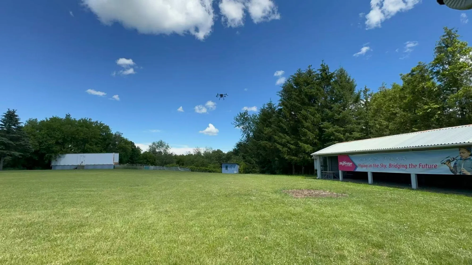 SkyBridge outdoor flying field beneath a blue sky