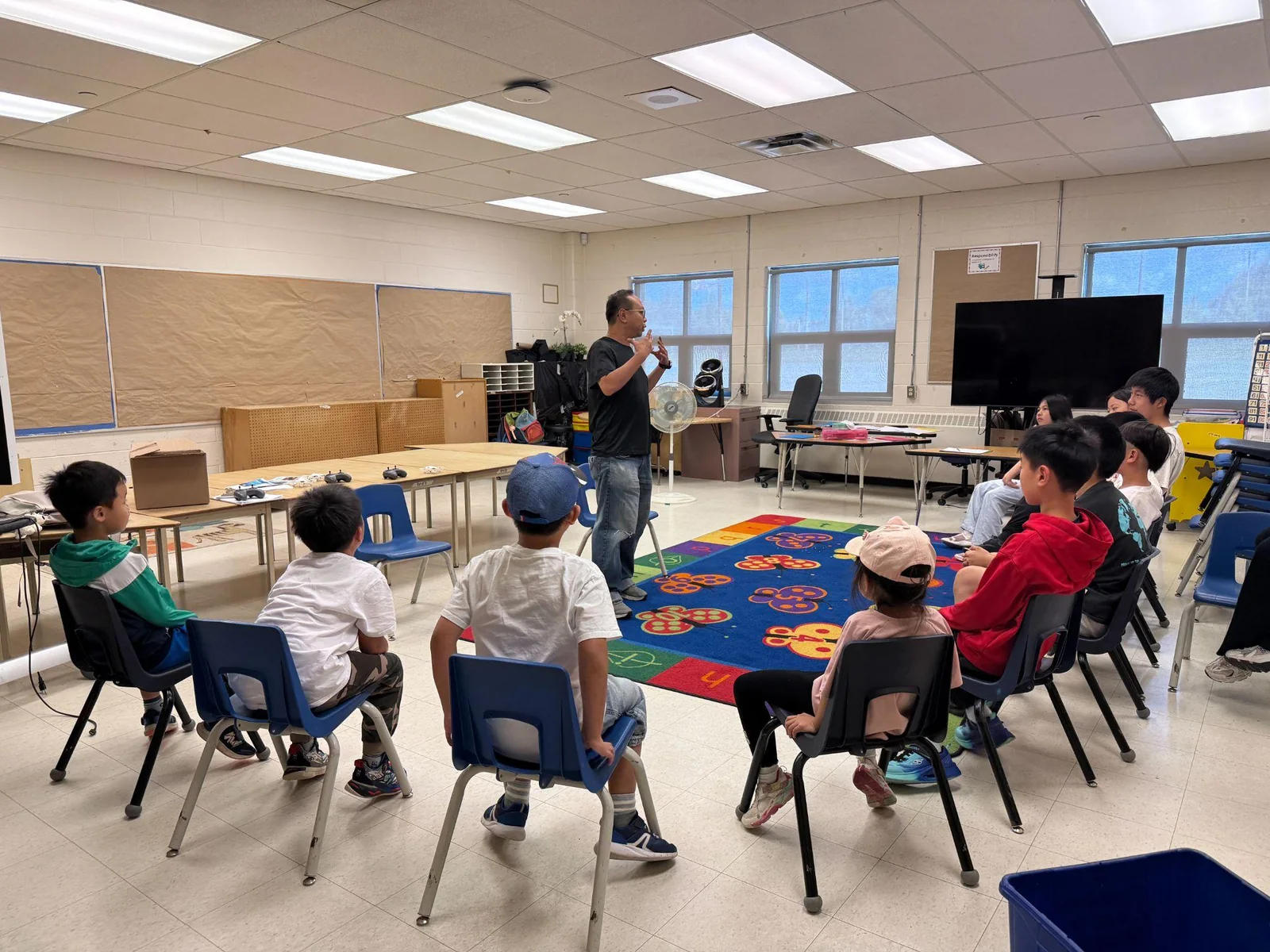 Students attending an interactive drone technology lesson in a classroom